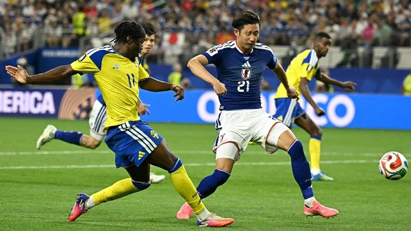 Japan reaches knockout stage after draw against Sweden.