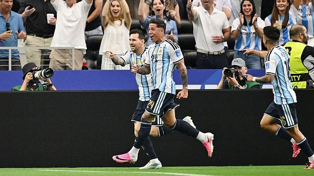 Messi scores two goals against Austria; Argentina advances to the knockout stage.
